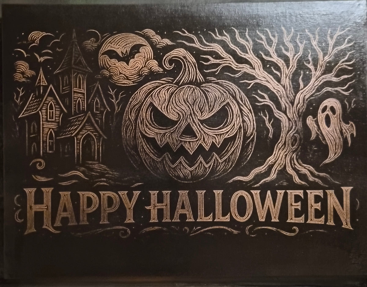 12x18 black Halloween canvas with laser-engraved haunted house, spooky pumpkin, ghost and Happy Halloween lettering in soft copper and metallic tones.